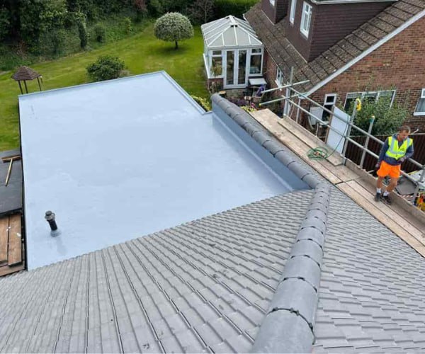 This is a photo of a newly installed hip roof, with a combined liquid covered flat roof. Work carried out by ATC Roofing Bromham