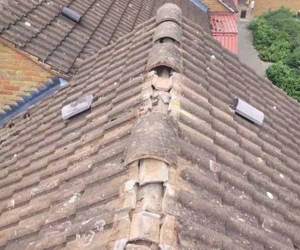 This is a photo if a roof ridge which has missing tiles. The ridge tiles are being replaced by ATC Roofing Bromham